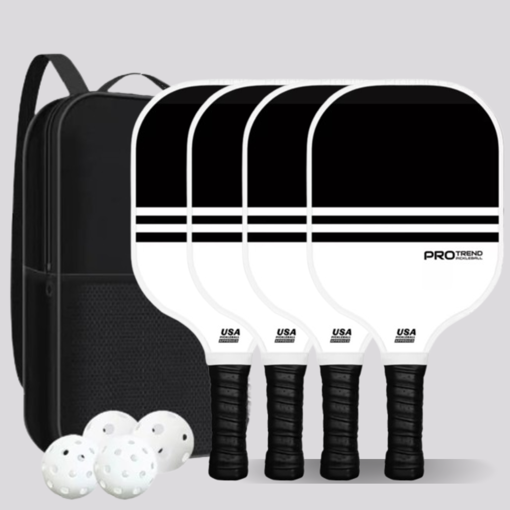 Set of four half black, half white pickleball paddles with a black backpack and 4 white balls on a gray background