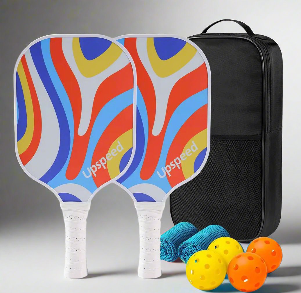 Pickleball paddle set of 2 paddles, 4 balls, 2 towels and a carrier bag. Design of the paddle is a artistic swirl of light and dark Blue, Yellow, Red and White.