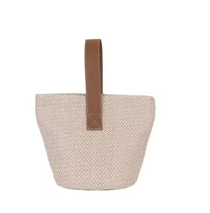 Beige straw bucket bag with brown handle