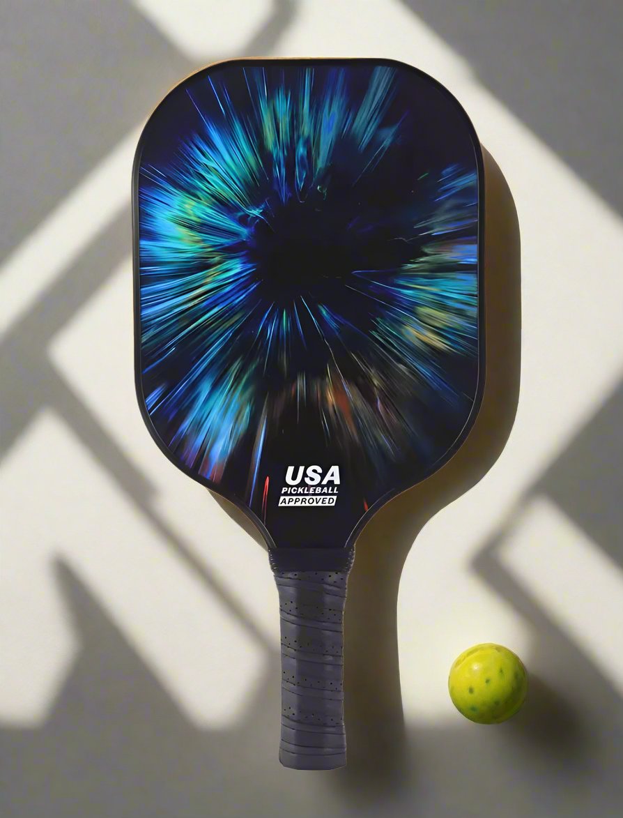 Single Pickleball Paddle with an artistic splash of different colours, mostly blue and with a black background, making it very outstanding. 
