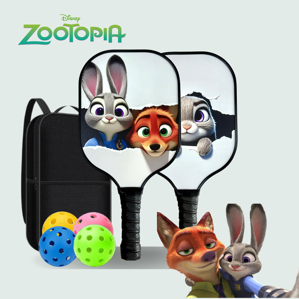 Zootopia-themed pickleball set featuring two paddle-shaped items printed with Judy Hopps and Nick Wilde artwork, a black backpack, and three colorful pickleballs on a light gray background. The Disney Zootopia logo appears at the top left.