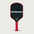 A Little Ripple Pickleball paddle with black face and red handle on a light gray background