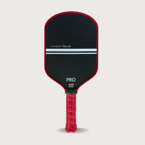 A Little Ripple Pickleball paddle with black face and red handle on a light gray background