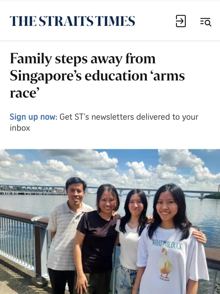 News article about a family stepping away from Singapore's education 'arms race' with a photo of four people by a waterfront.