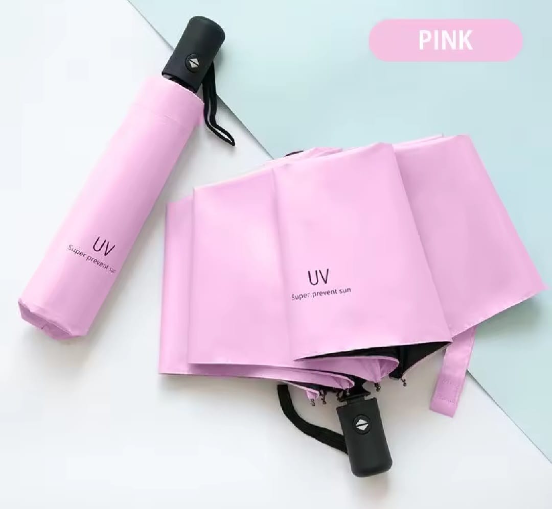 Pink compact folding umbrella shown both folded and unfolded on a light pastel background, with a pink label reading PINK in the top right.