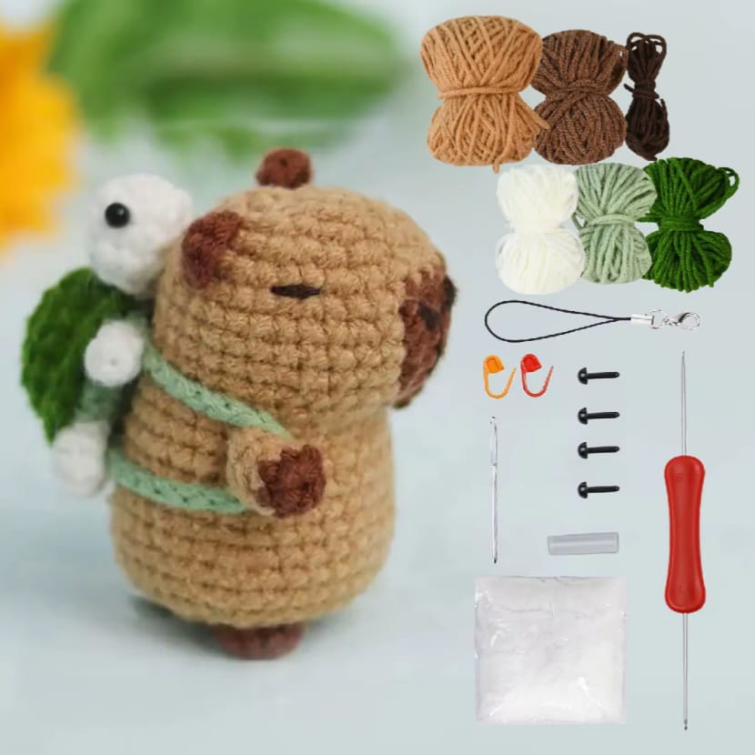 Coco the capybara carrying a turtle bag. Comes with 6 different colours fo yarn, 2 safety pins, 2 pairs of eyes, a crochet hook, a darning needle and stuffing. 
