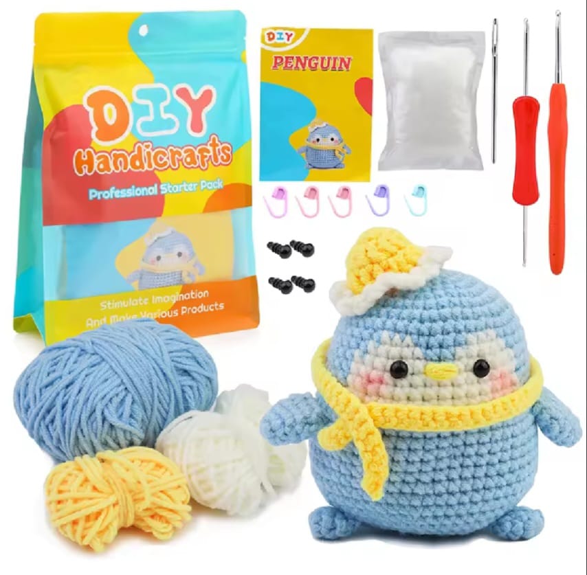 Beginner Crochet Blue Penguin with a  yellow scarf and little hat set.
