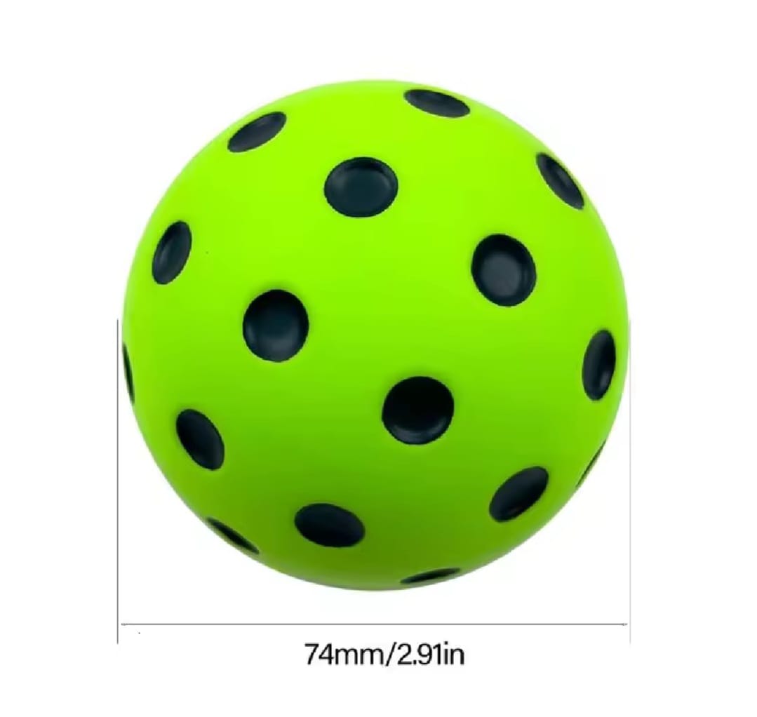 Green ball with black dots and measurements of 74mm/2.91in on a white background