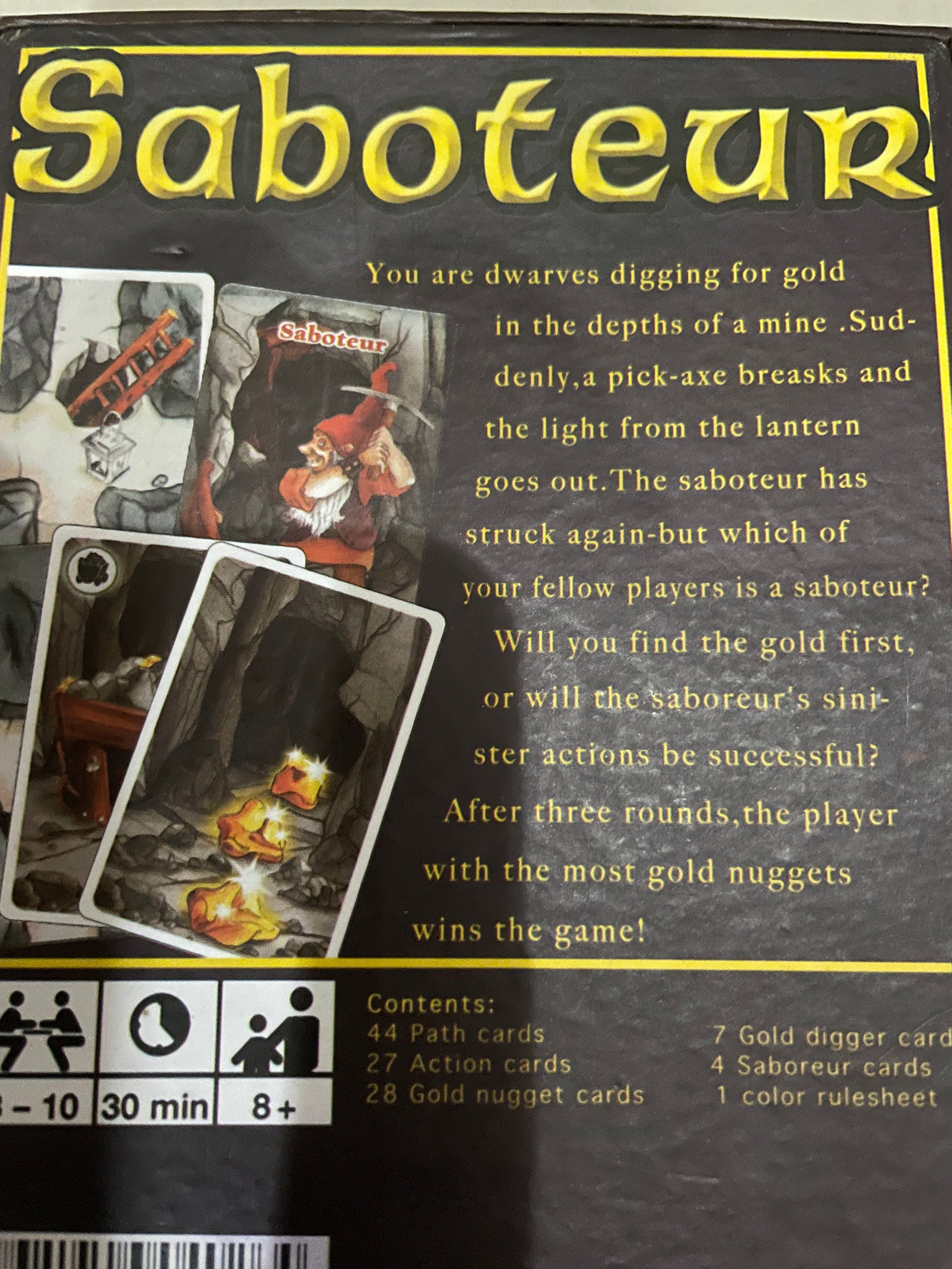 Saboteur card game description: You are dwarves digging for gold in the depths of a mine. Suddenly, a pic-axe breaks and the light from the lantern goes out. The saboteur has struck again -but which of your fellow players is a saboteur? Will you find the gold first or will the saboteur's sinister actions be successful? After three rounds, the player with the most gold nuggets wins the game! 