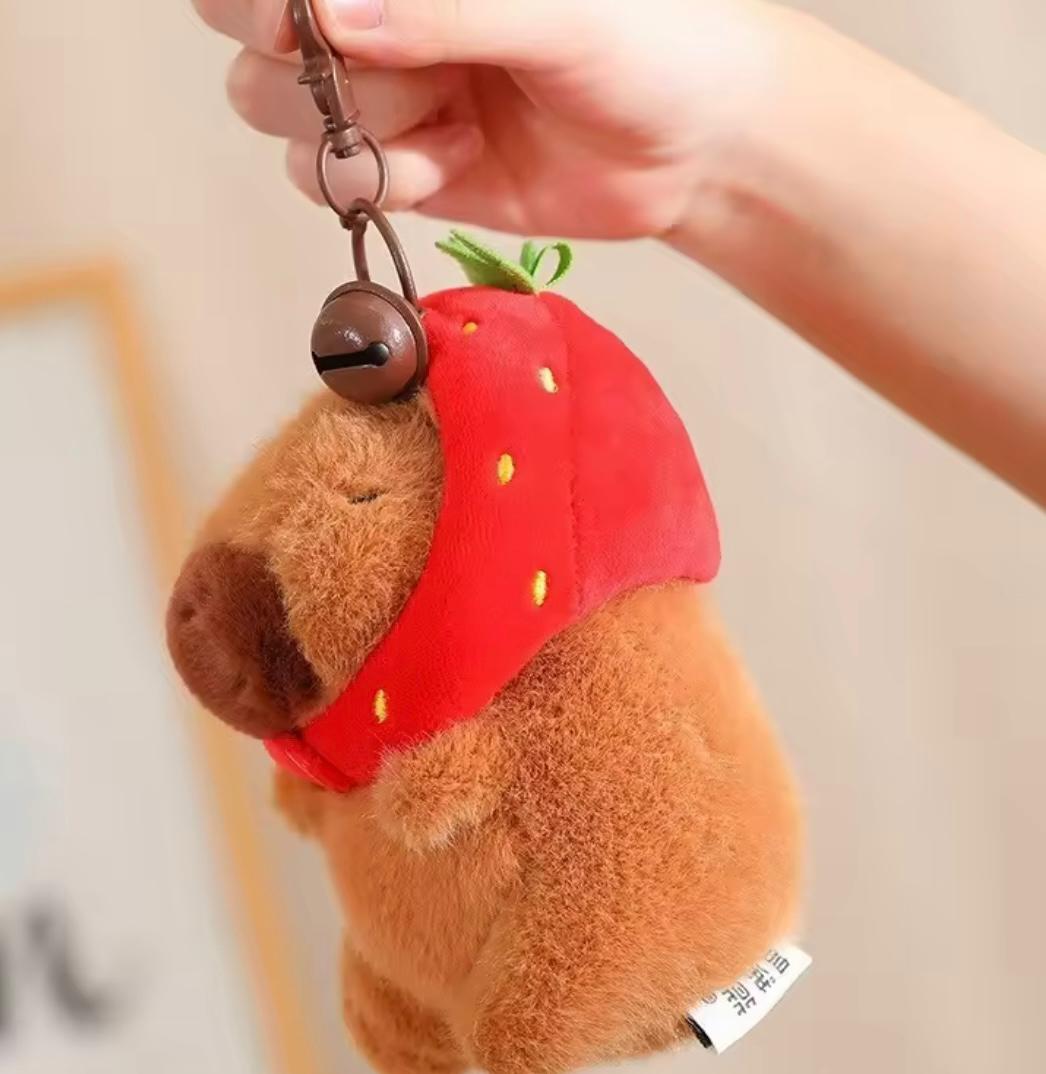 Capybara keychain with a removable strawberry hat