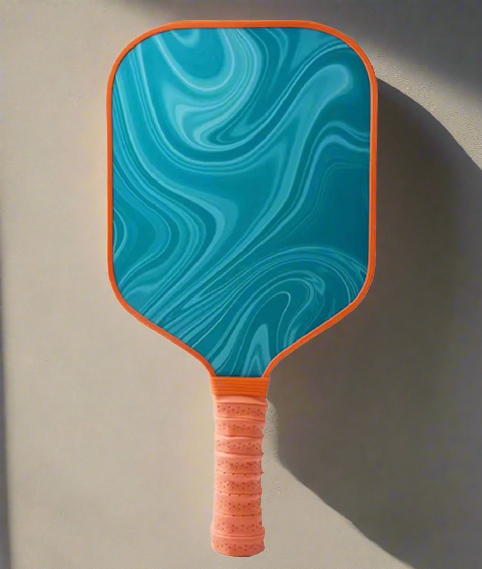 Pickleball Paddle with green swirl and orange rims.